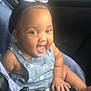 baby, child, smiling, happy, car_seat, blue_outfit, bow, hair_accessory, infant, cute, portrait, sitting, indoor, clothing, person, face, skin, hand, foot, young_child