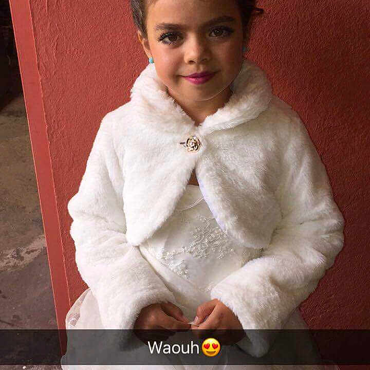 Hannah a rejoint le concours — aidez-le/la à gagner de superbes lots ! bridal_clothing, bride, child, child_model, fur, fur_clothing, girl, gown, joy, material, outerwear, person, textile, wedding_dress