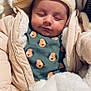 baby, sleeping, coat, jacket, knit_hat, blanket, infant, onesie, dog_pattern, warm_clothing, cute, face, child, soft, fur_lining, resting, indoors, portrait, newborn, cozy