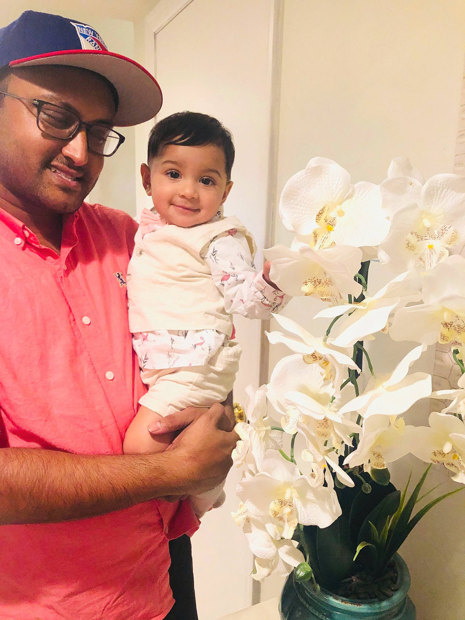 Inayat is registered to the contest to win money with this photo: art, artificial_flower, child, daughter, father, floral_design, floristry, flower, flower_arranging, happy, headwear, joy, mother, person, plant, smile, toddler