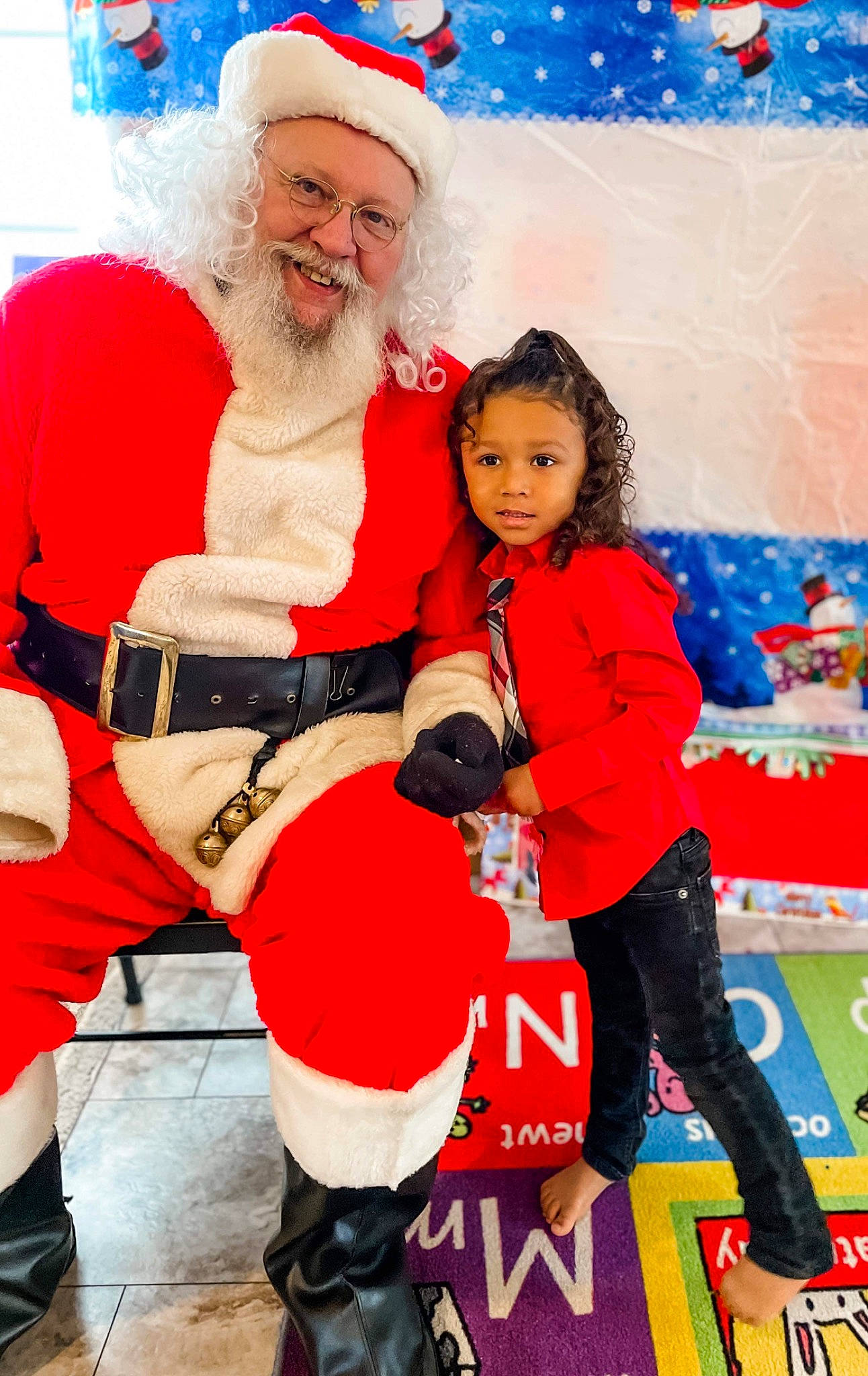 Armoni is registered to the contest to win money with this photo: beard, boot, christmas, christmas_eve, event, fictional_character, footwear, fun, happy, hat, headwear, holiday, joy, lap, person, red, santa_claus, shoe, smile, sneakers