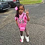 Chozyn joined the competition — help win amazing prizes! child, girl, pink_clothing, leopard_print, braided_hair, bow, peace_sign, sneakers, parking_lot, cars, outdoor, pavement, grass, trash_bins, sidewalk, fashion, cute, posing, accessory, playful