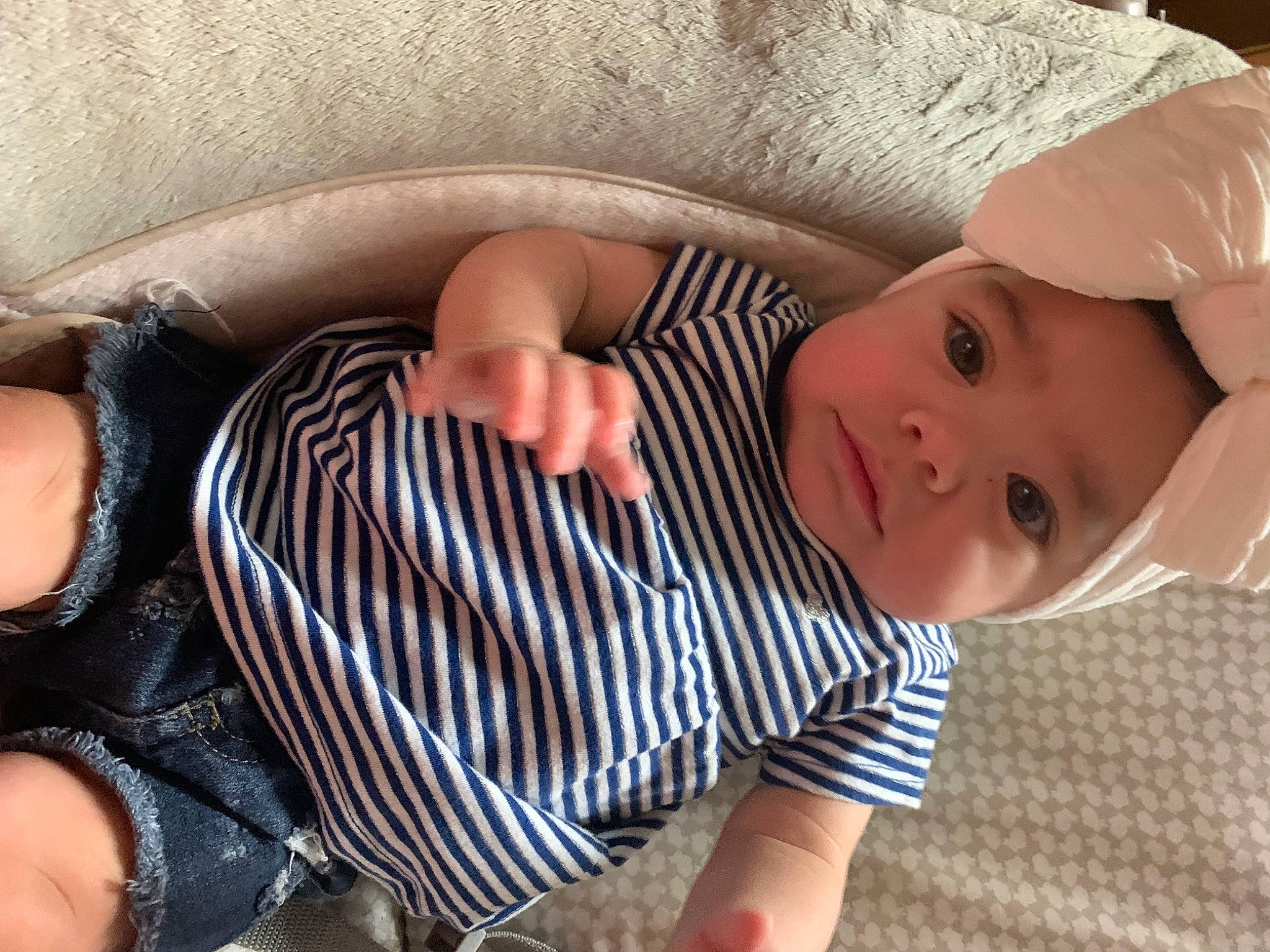 Laylia is registered to the contest to win money with this photo: baby, baby_products, baby_toddler_clothing, child, comfort, eye, finger, foot, hat, headwear, human_body, human_leg, linens, pattern, person, sitting, skin, sleeve, sock, thigh