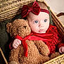 baby, teddy_bear, red_bow, red_outfit, basket, woven_basket, plush_toy, child, cute, portrait, indoor, cuddling, soft_toy, infant, headband, hand, expression, cozy, warm_lighting, closeup