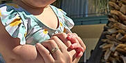 Chloe is registered to the contest to win money with this photo: accessories, arm, baby, babylaughing, bodypart, bracelet, face, happy, head, jewelry, laughing, palmtree, person, photography, plant, portrait, pottedplant, smile, summer, tree