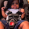 Makaio joined the competition — help win amazing prizes! baby, baby_face, car_seat, child, close_up, clothing, cute, expression, hands, hood, indoor, infant, person, portrait, safety, seat, seat_belt, shorts, striped_shirt, young_child