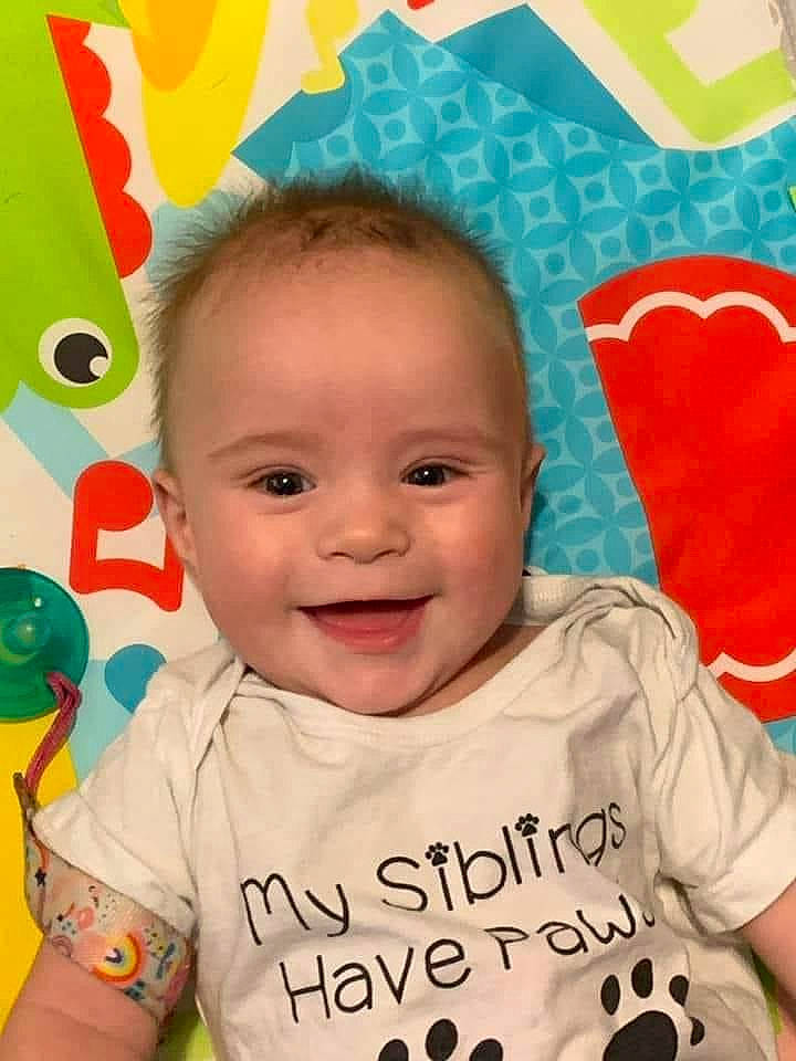 Korra is registered to the contest to win money with this photo: baby_toddler_clothing, cheek, child, chin, eyebrow, face, facial_expression, hairstyle, happy, head, iris, joy, nose, organ, person, pink, product, skin, sleeve, smile