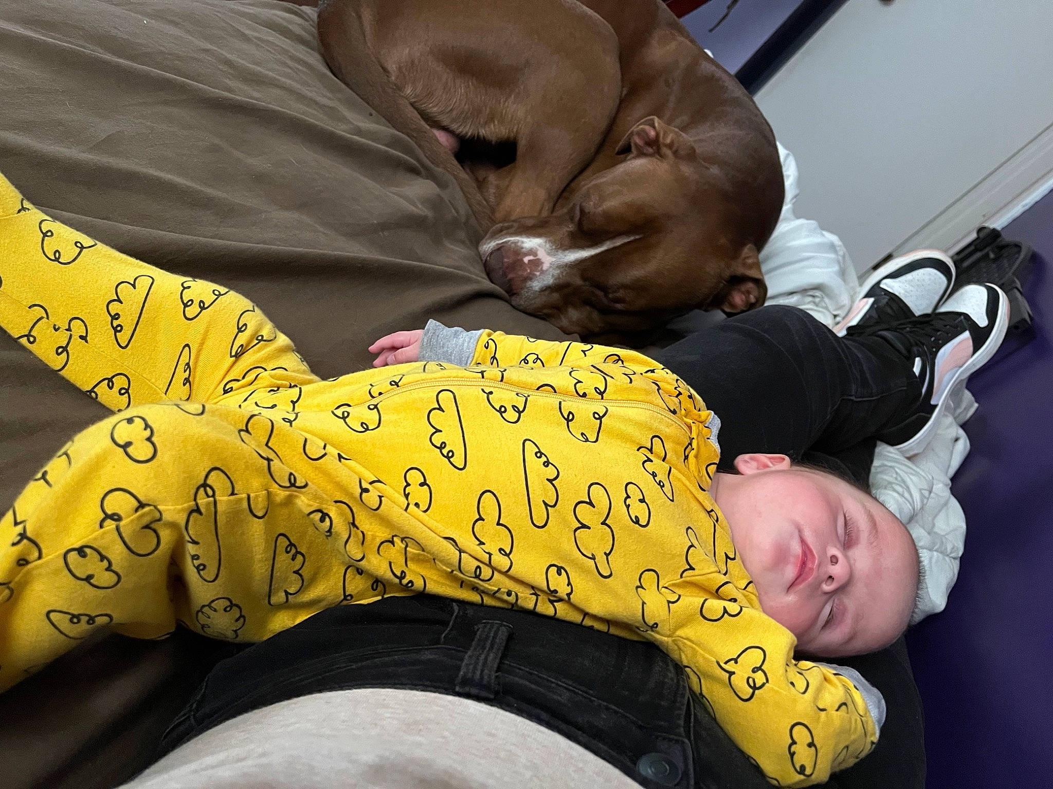 Korra is registered to the contest to win money with this photo: abdomen, baby, barefoot, child, comfort, elbow, foot, fun, gesture, hand, happy, human_leg, knee, lap, nap, person, room, sitting, sleeve, sock