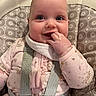 Meredith joined the competition — help win amazing prizes! baby, infant, child, high_chair, seatbelt, pink_clothing, patterned_fabric, hand_in_mouth, smile, happy, face, blue_eyes, cute, indoor, portrait, closeup, baby_girl, soft_lighting, cozy, sitting