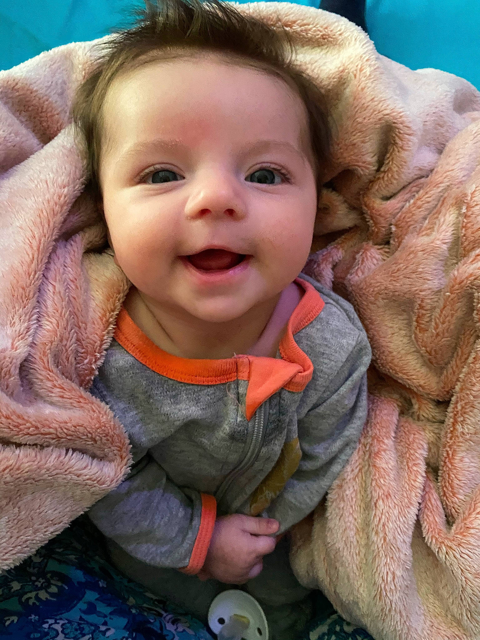 Skylar is registered to the contest to win money with this photo: baby, blue, cheek, chin, eye, eyebrow, finger, gesture, happy, head, human_body, iris, lip, mouth, nose, organ, person, product, skin, sleeve