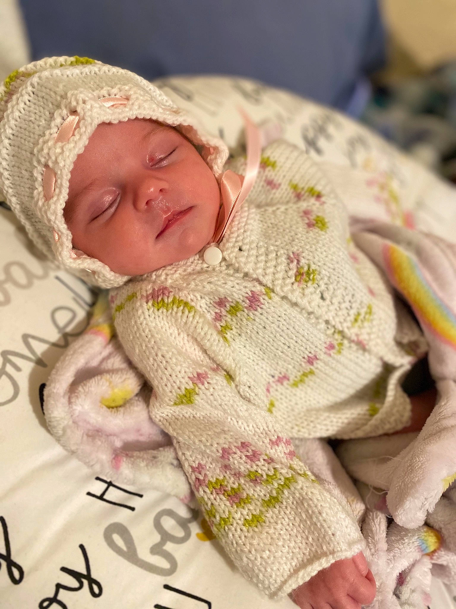 Skylar joined the competition — help win amazing prizes! baby, baby_products, baby_sleeping, baby_toddler_clothing, cap, cheek, comfort, creative_arts, hand, hat, headgear, headwear, knit_cap, linens, pattern, person, pink, skin, sleeve, textile