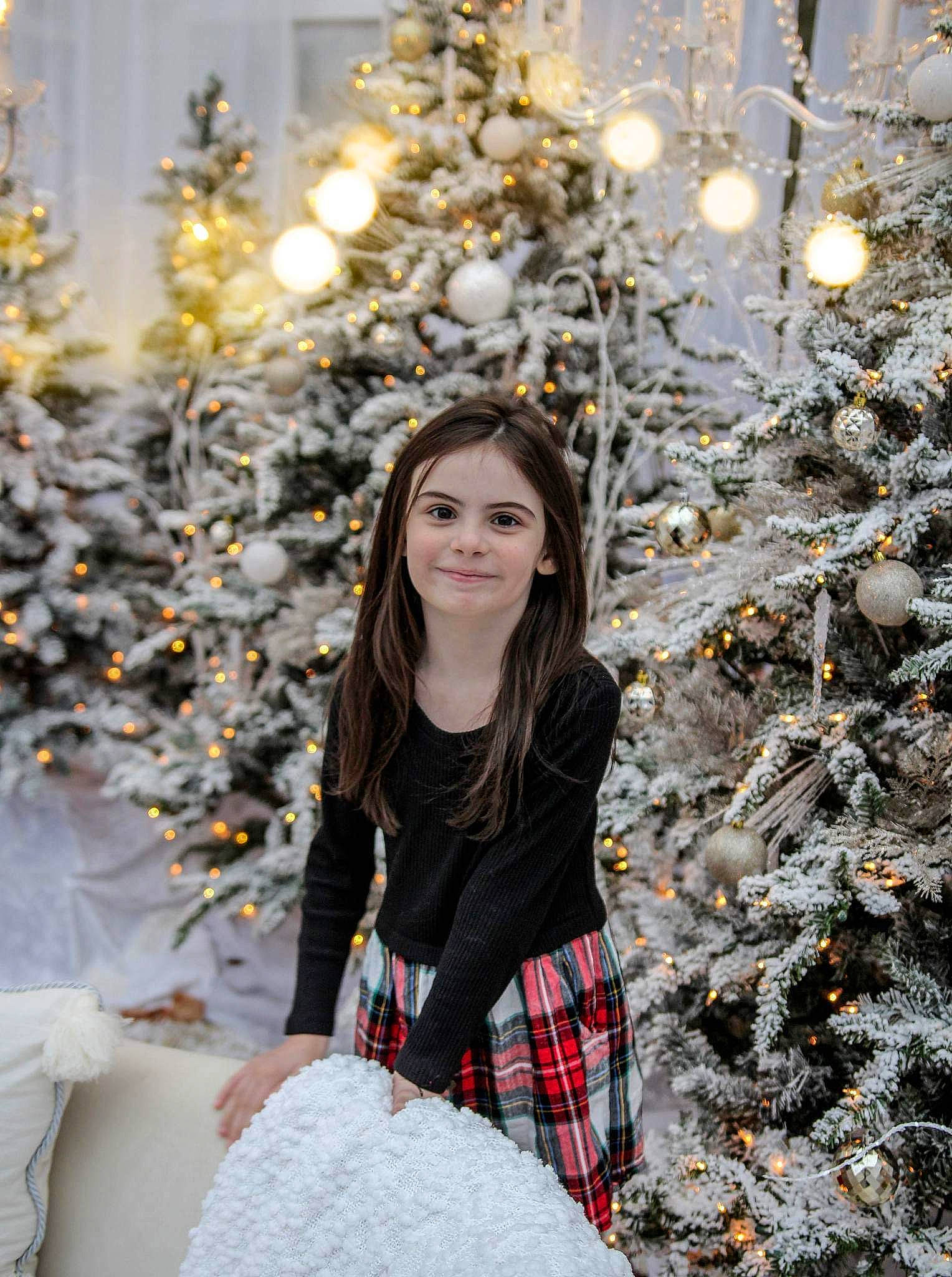 Annabelle joined the competition — help win amazing prizes! branch, christmas_decoration, christmas_ornament, christmas_tree, eye, facial_expression, freezing, hair, hairstyle, happy, head, holiday_ornament, human_body, joy, ornament, people_in_nature, person, photograph, plant, tartan