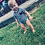 toddler, child, grass, barefoot, onesie, striped_clothing, outdoor, playground, smile, baby, person, curious, young_child, head, face, short_hair, daylight, nature, fun, candid
