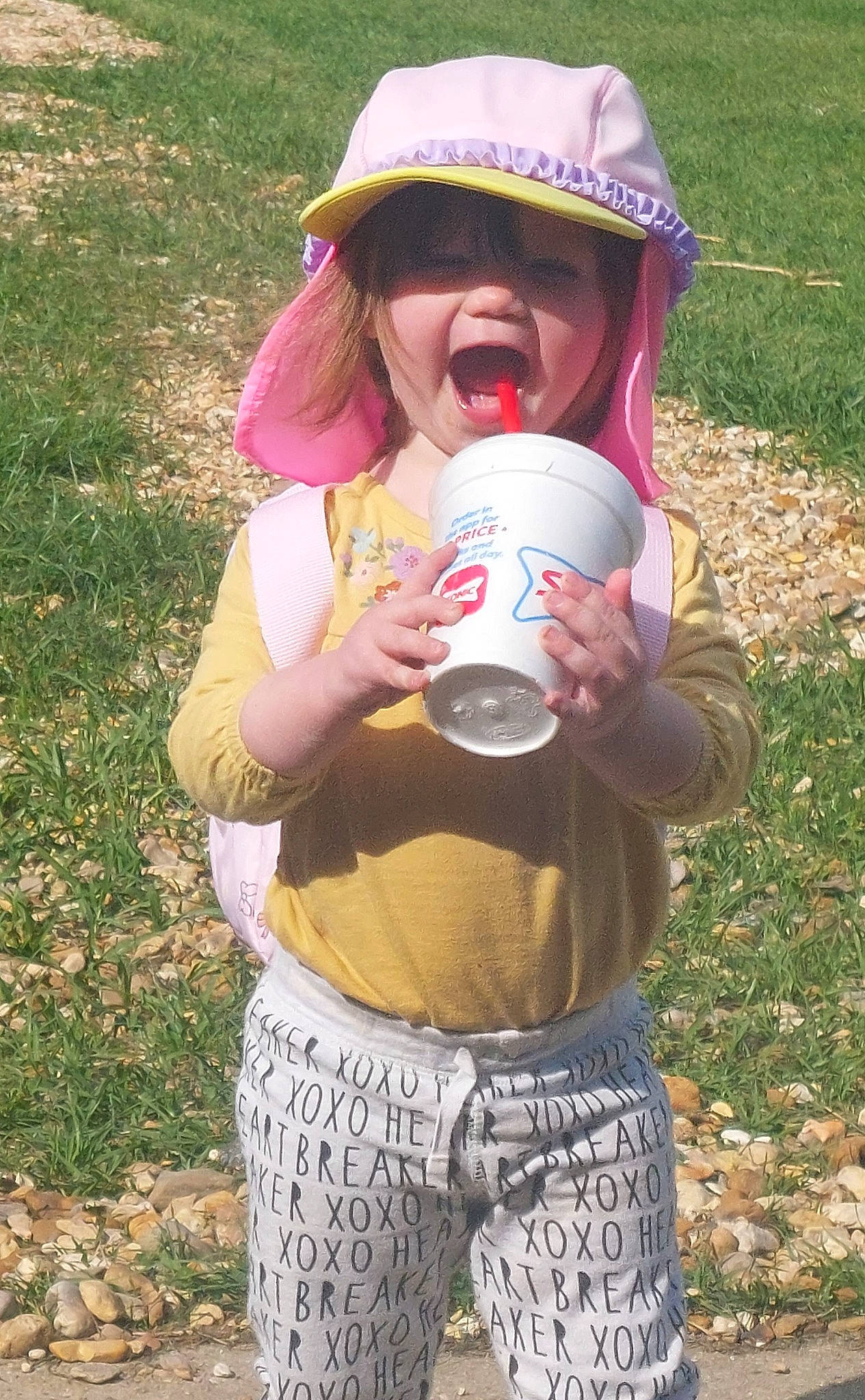 Angel joined the competition — help win amazing prizes! baby_products, baby_toddler_clothing, carmine, child, face, fun, grass, grassland, happy, headgear, leaf, leisure, people_in_nature, person, personal_protective_equipment, pink, plant, recreation, soil, t_shirt