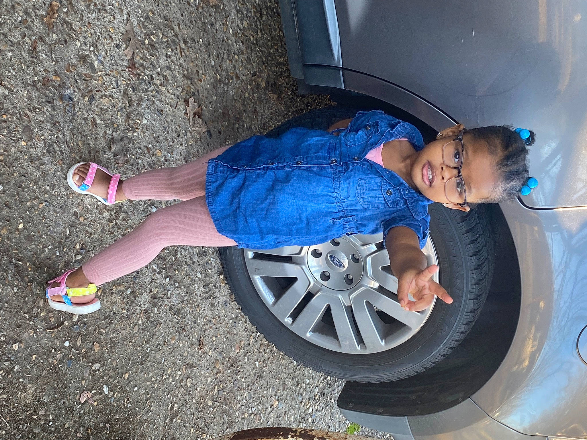 Myrah is registered to the contest to win money with this photo: alloy_wheel, automotive_design, automotive_exterior, automotive_lighting, automotive_tire, bumper, car, hand, hood, hubcap, land_vehicle, leg, motor_vehicle, person, shoe, smile, tire, tread, vehicle, vehicle_door