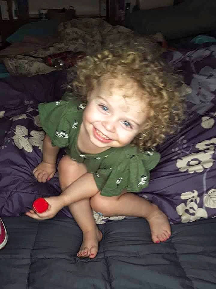 Abby is registered to the contest to win money with this photo: cheek, child, eye, fun, iris, joy, person, sitting, skin, smile, toddler