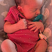 Melody is registered to the contest to win money with this photo: newborn, baby, sleeping, infant, pacifier, pink_outfit, polka_dots, crib, bedding, portrait, indoor, resting, curled_up, bare_feet, toes, peaceful, child, face, nursery, cozy