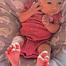 baby, infant, child, portrait, lying_down, sitting, pink_onesie, curious, awake, face, hands, feet, bare_feet, cushion, blanket, elephant_pattern, nursery, indoor, adorable, photograph
