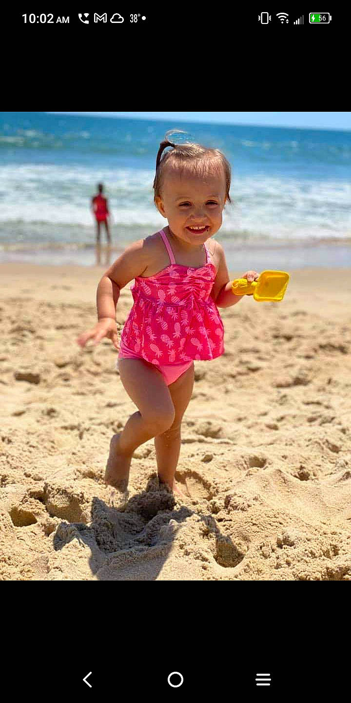 Cora joined the competition — help win amazing prizes! beach, coastal_and_oceanic_landforms, dress, fun, happy, human_leg, joy, leg, leisure, morning, people_in_nature, people_on_beach, person, recreation, shore, sky, smile, sunlight, thigh, toddler