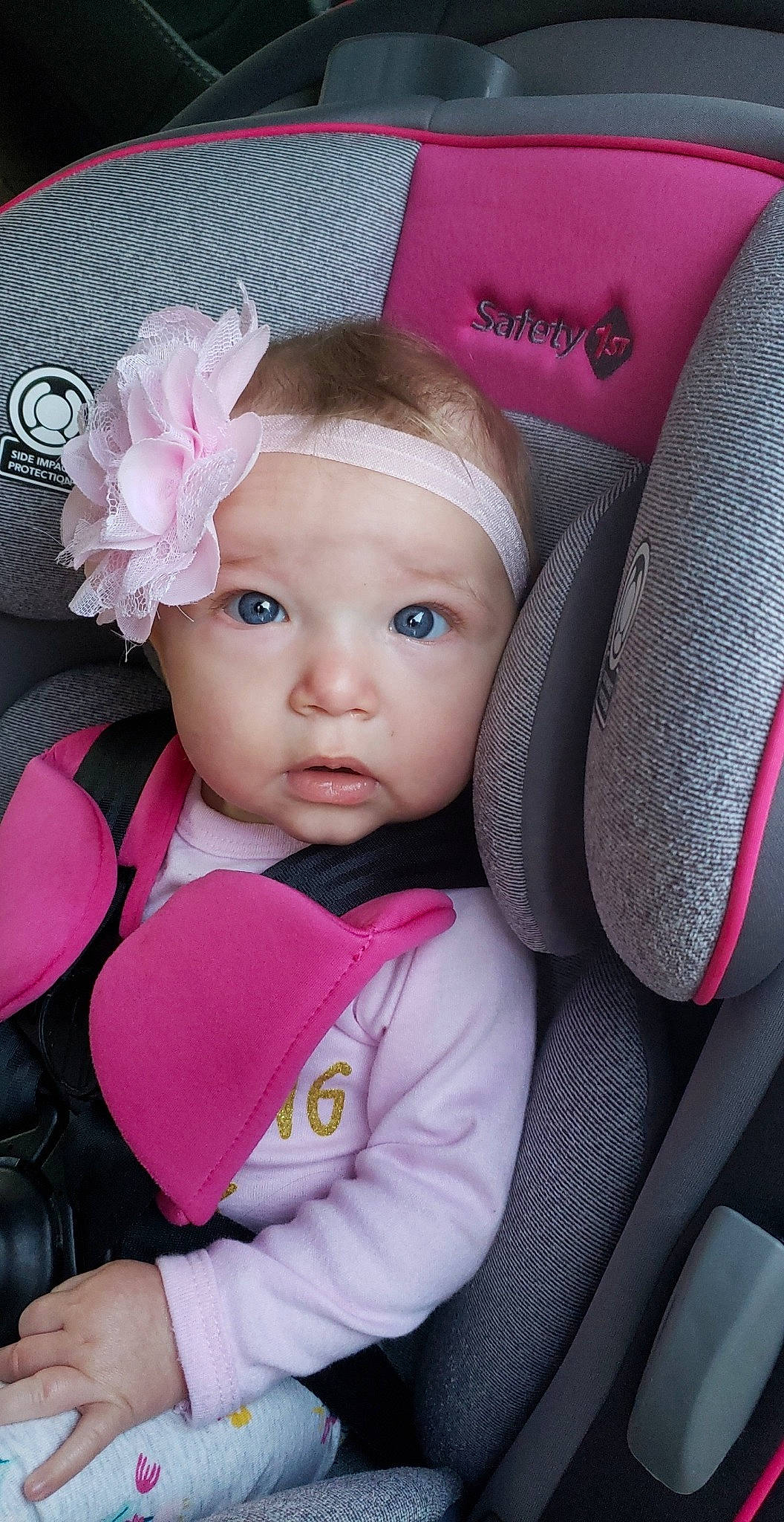 Oakleigh is registered to the contest to win money with this photo: auto_part, baby, baby_carriage, baby_in_car_seat, baby_products, car_seat, car_seat_cover, cheek, child, hair_accessory, head, person, pink, product, seat_belt, skin, toddler