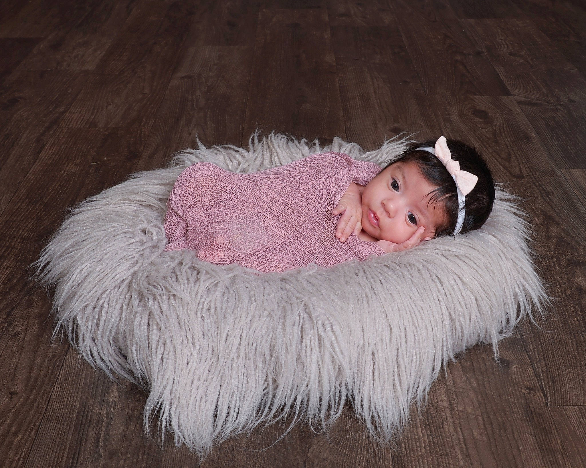 Kaylin is registered to the contest to win money with this photo: art, baby, baby_toddler_clothing, cheek, child, comfort, eye, fashion_accessory, flash_photography, flooring, fur, fur_clothing, grass, hair_accessory, headgear, person, sitting, smile, toddler, wood