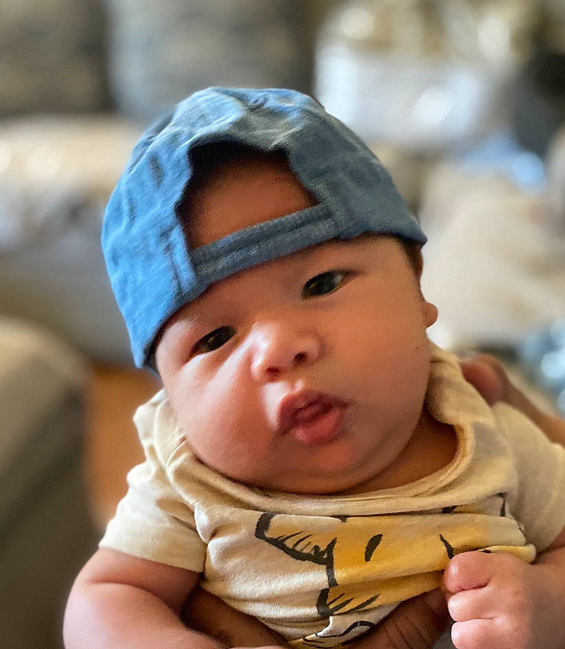 David joined the competition — help win amazing prizes! baby, baby_toddler_clothing, beanie, cap, cheek, child, comfort, eye, fashion_accessory, fun, happy, hat, headwear, knit_cap, person, portrait_photography, sitting, skin, sleeve, thumb