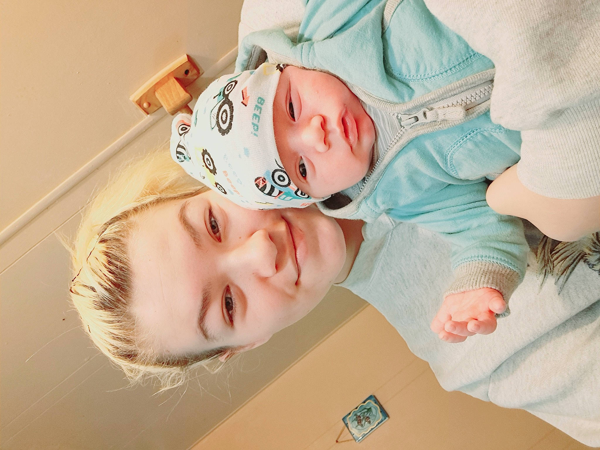 Weston is registered to the contest to win money with this photo: baby, baby_toddler_clothing, cheek, child, comfort, eyelash, fun, gesture, happy, hat, headwear, joy, mouth, neck, nose, person, portrait_photography, room, skin, sleeve