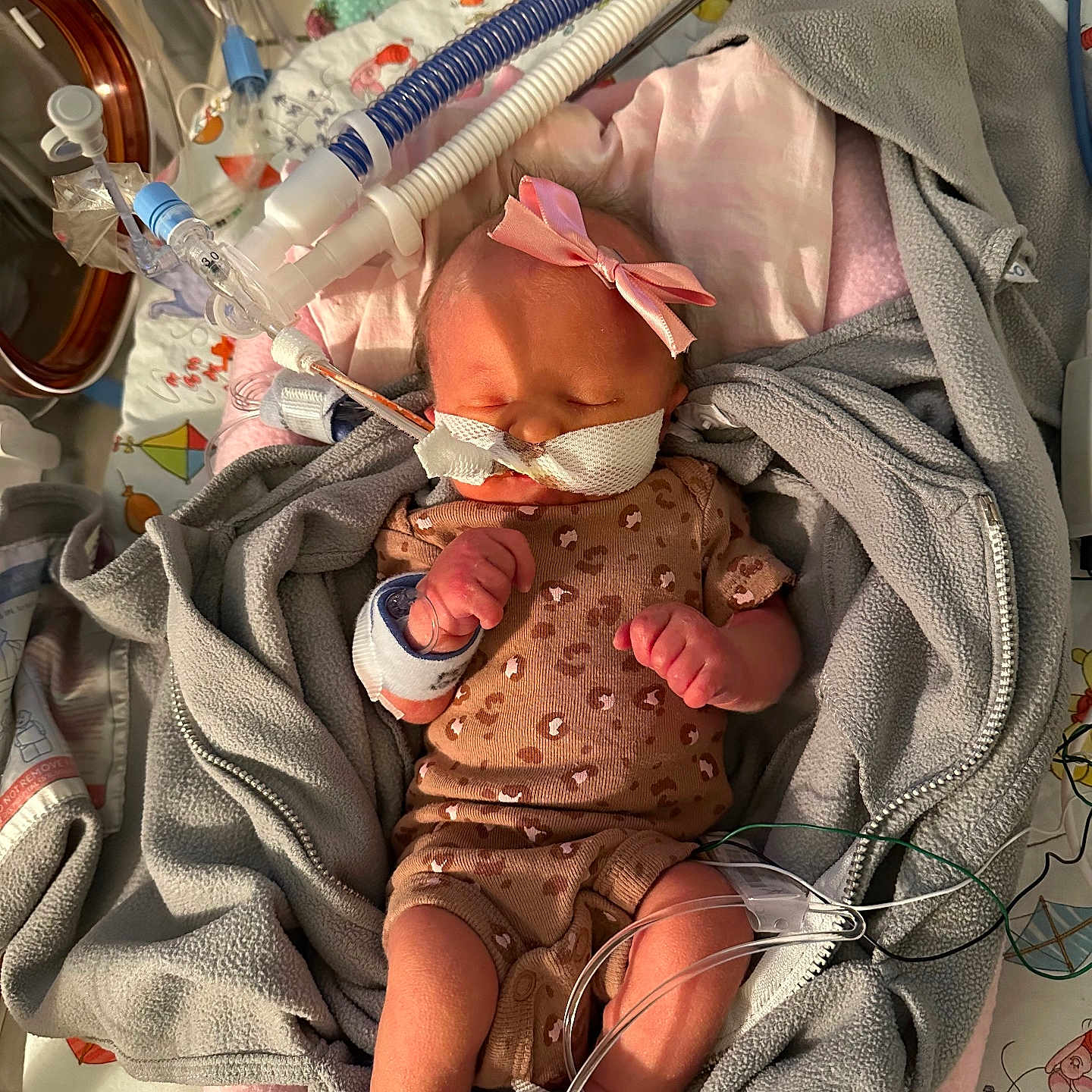 Maggie joined the competition — help win amazing prizes! architecture, baby, bed, blanket, building, childbirth, crib, face, furniture, head, hospital, infantbed, newborn, person, photography, portrait, sleeping