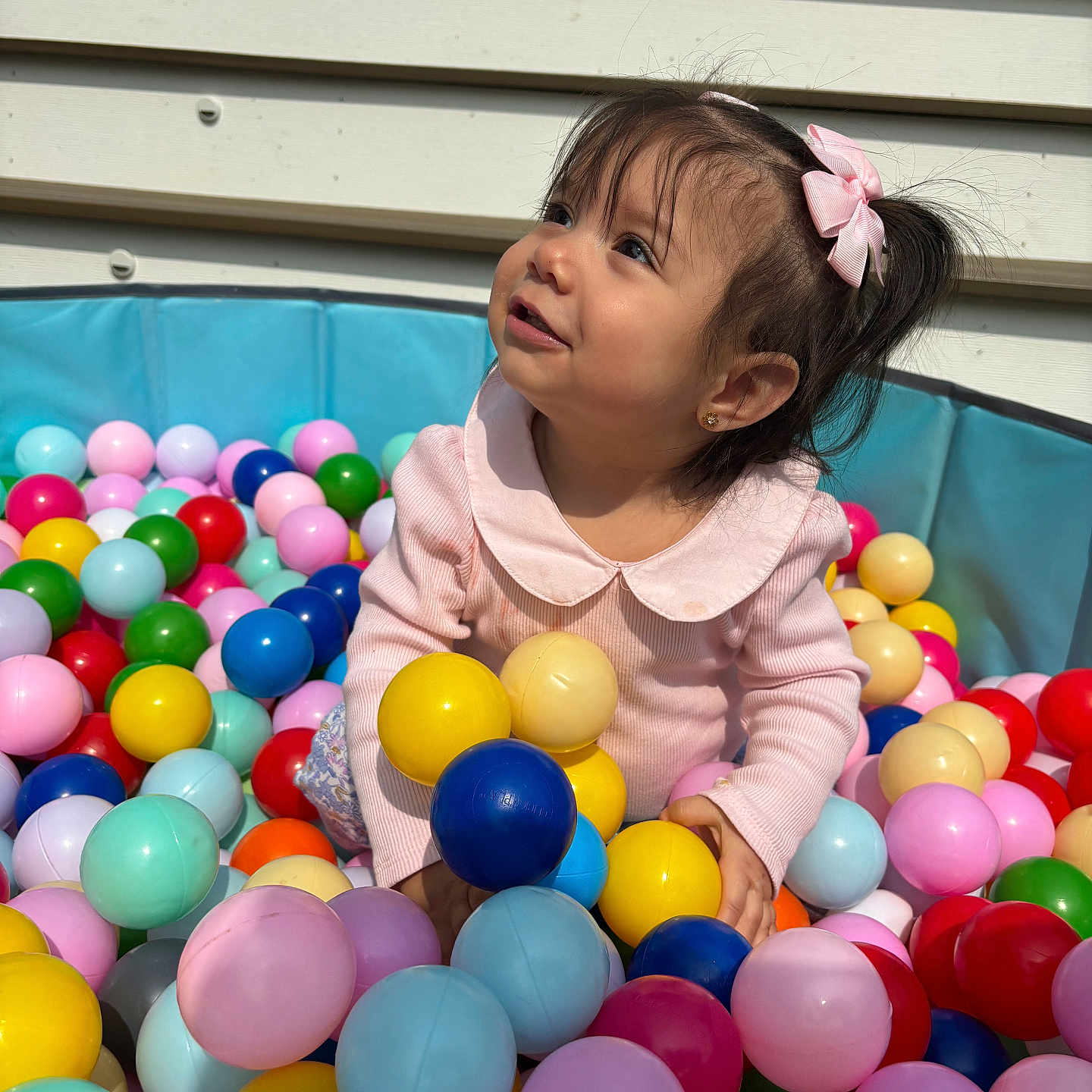 Julianna is registered to the contest to win money with this photo: accessories, baby, balloon, bodypart, candy, face, finger, food, hand, head, indoorplayarea, indoors, inflatable, people, person, photography, playarea, portrait, sphere, sweets