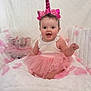 Amber joined the competition — help win amazing prizes! baby, child, unicorn_headband, pink_tutu, smiling, sitting, stuffed_animal, elephant_toy, fluffy_blanket, pink_petals, white_background, cute, happy, portrait, indoor, adorable, infant, headband, dress, playful