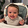 baby, high_chair, smile, happy, child, indoor, face, person, clothing, furniture, plant, home, cute, portrait, toddler, feeding, cheerful, young, infant, seat
