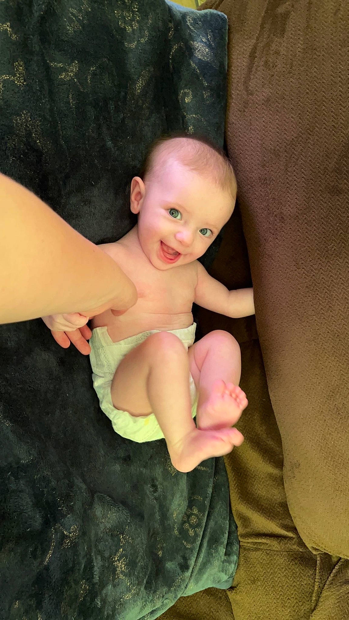 Lydia joined the competition — help win amazing prizes! baby, baby_toddler_clothing, barefoot, cheek, chest, comfort, eye, finger, flash_photography, gesture, human_body, knee, neck, person, shoulder, skin, smile, stomach, thigh, thumb