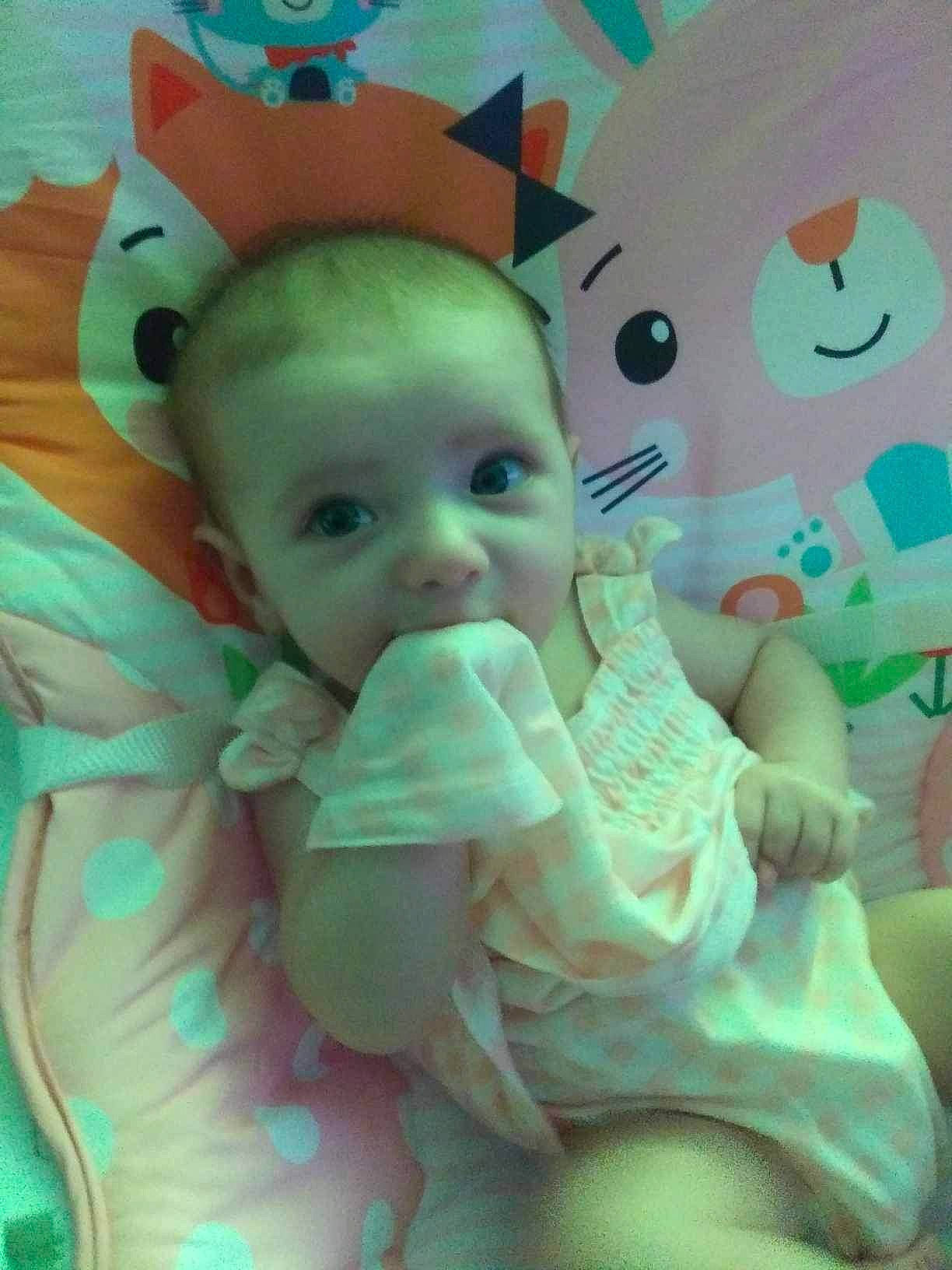 Lydia joined the competition — help win amazing prizes! aqua, baby, baby_toddler_clothing, cheek, child, eye, eyebrow, facial_expression, fun, hairstyle, happy, head, iris, mouth, person, pink, product, skin, textile, toddler