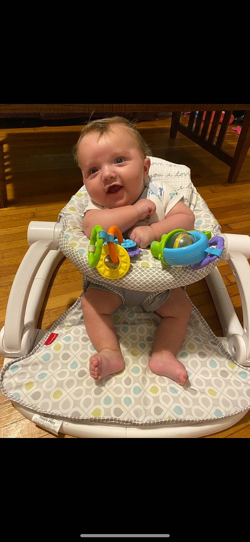 Elias is registered to the contest to win money with this photo: baby, baby_products, baby_safety, baby_toddler_clothing, baby_toys, chair, child, comfort, flooring, foot, fun, furniture, happy, head, leisure, person, product, sitting, smile, textile
