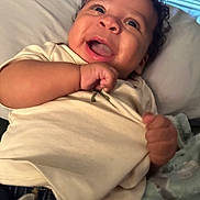 Oliver joined the competition — help win amazing prizes! baby, smiling, happy, infant, clothing, pillow, blanket, hand, face, cute, indoor, cheerful, person, portrait, child, casual, relaxed, toddler, joy, expression