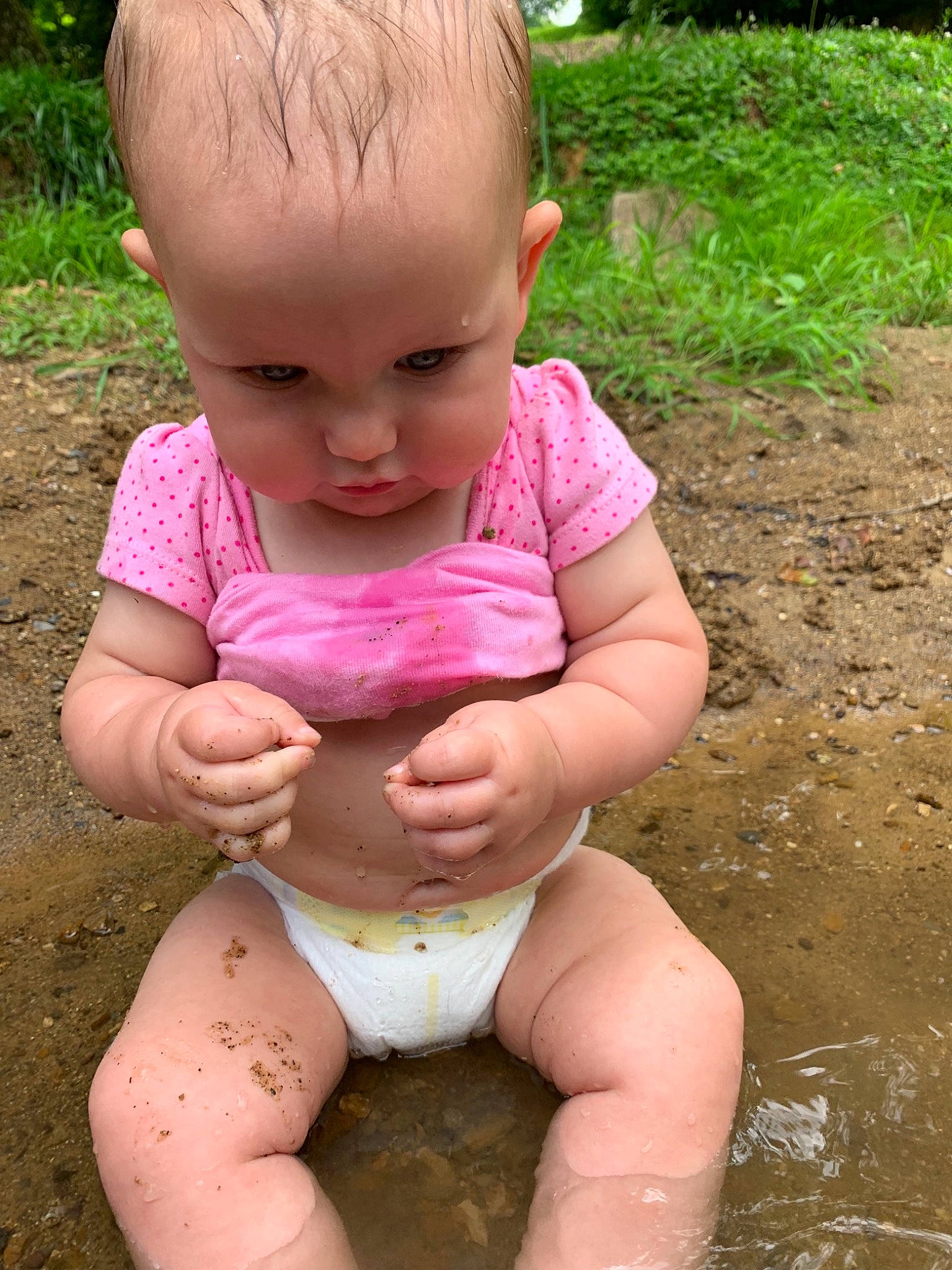 Jenesis joined the competition — help win amazing prizes! baby, baby_toddler_clothing, child, grass, hand, mud, person, play, sitting, skin, smile, soil, toddler