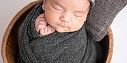 Melissa participe au concours pour gagner de l'argent avec cette photo : baby, newborn, sleeping, swaddled, blanket, headband, flower, bucket, wooden, pillow, cozy, cute, infant, portrait, soft, peaceful, resting, indoors, child, adorable