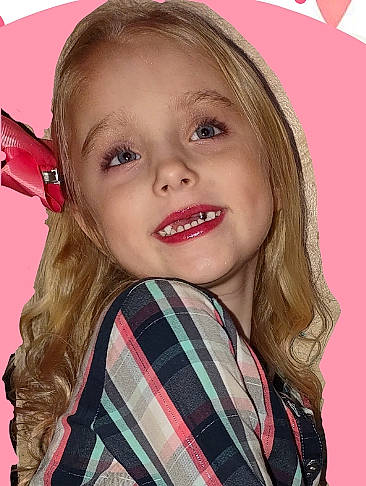 Lailani is registered to the contest to win money with this photo: bangs, blond, brown_hair, cheek, chin, eyebrow, eyelash, happy, iris, jaw, joy, layered_hair, lip, long_hair, neck, nose, person, plaid, skin, sleeve