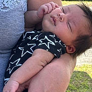 Tylyza joined the competition — help win amazing prizes! baby, sleeping, arm, person, clothing, outdoor, grass, hand, face, closeup, skin, infant, star_pattern, sleeveless, holding, peaceful, young_child, portrait, casual_wear, rest