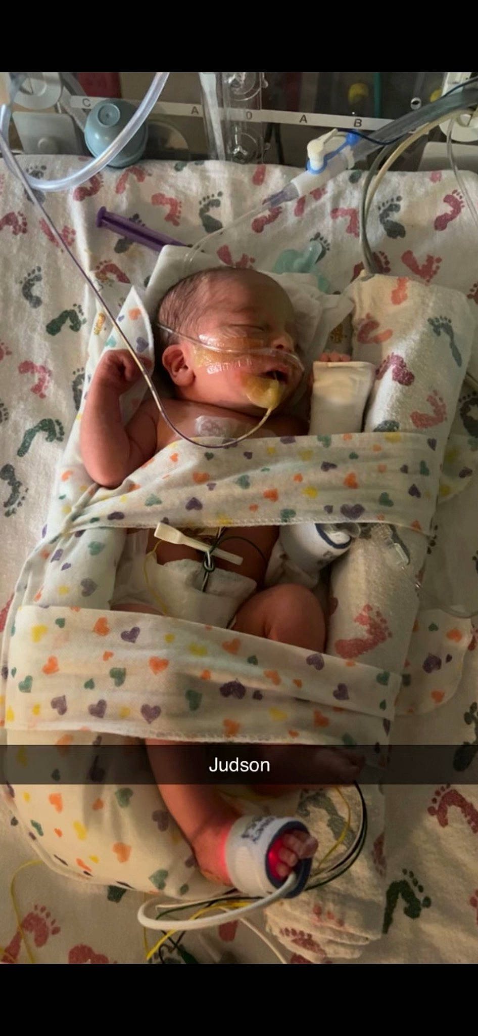 Judson joined the competition — help win amazing prizes! baby, baby_products, baby_safety, baby_toddler_clothing, bed_sheet, bedding, bedtime, child, comfort, glasses, infant_bed, linens, pattern, person, pink, product, room, sitting, textile, toddler