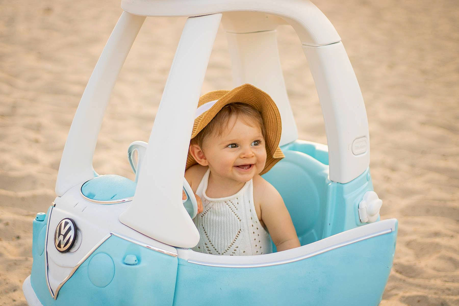 Evangeline is registered to the contest to win money with this photo: baby, baby_products, baby_toddler_clothing, child, circle, comfort, facial_expression, fashion_accessory, fun, happy, joy, leisure, people_in_nature, person, plastic, play, recreation, sitting, smile, toddler