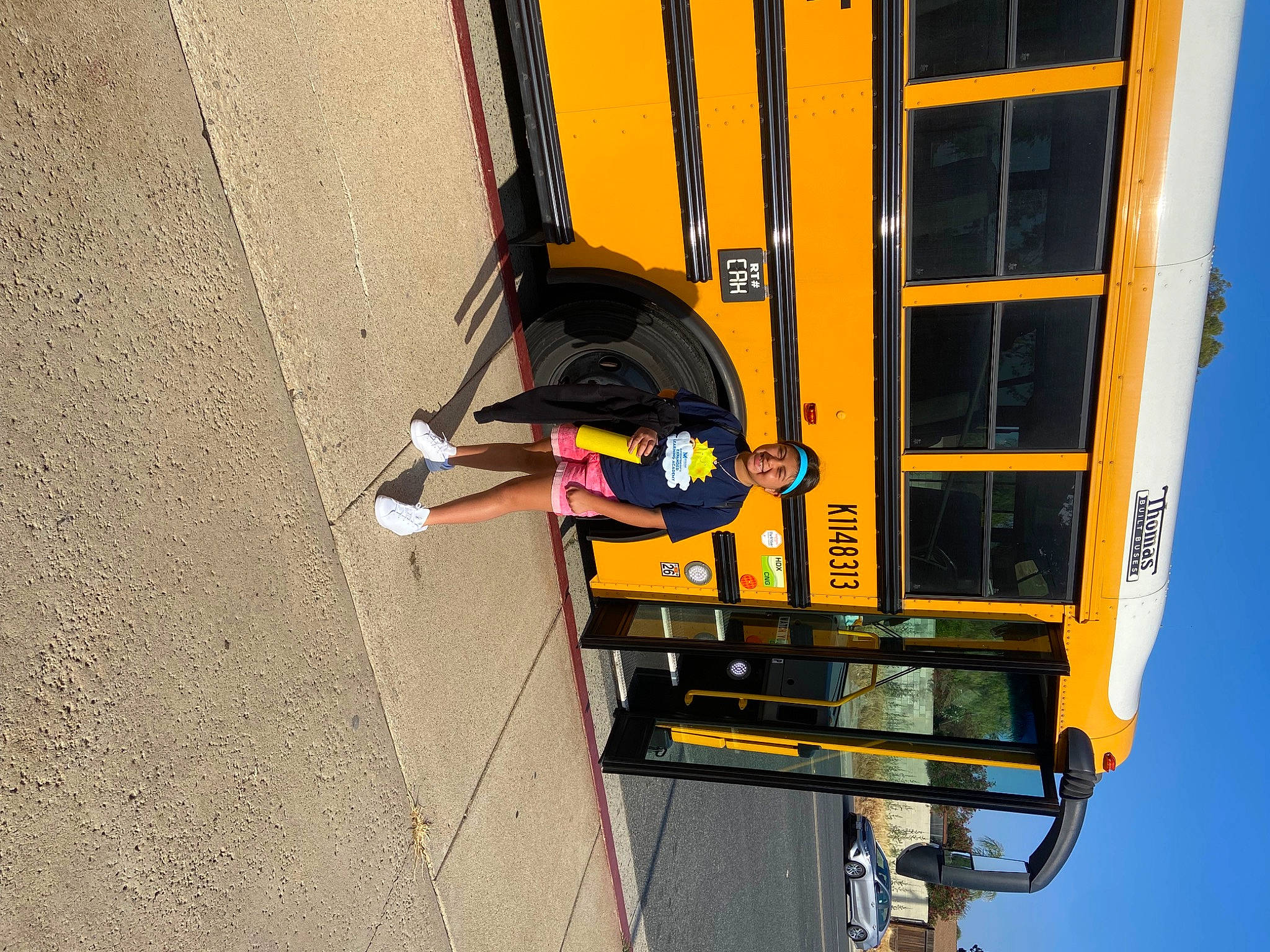 Jayleen is registered to the contest to win money with this photo: asphalt, auto_part, automotive_exterior, automotive_tire, automotive_wheel_system, bumper, bus, fender, headwear, joy, machine, motor_vehicle, person, public_utility, rolling, sky, tire, tire_care, travel, vehicle