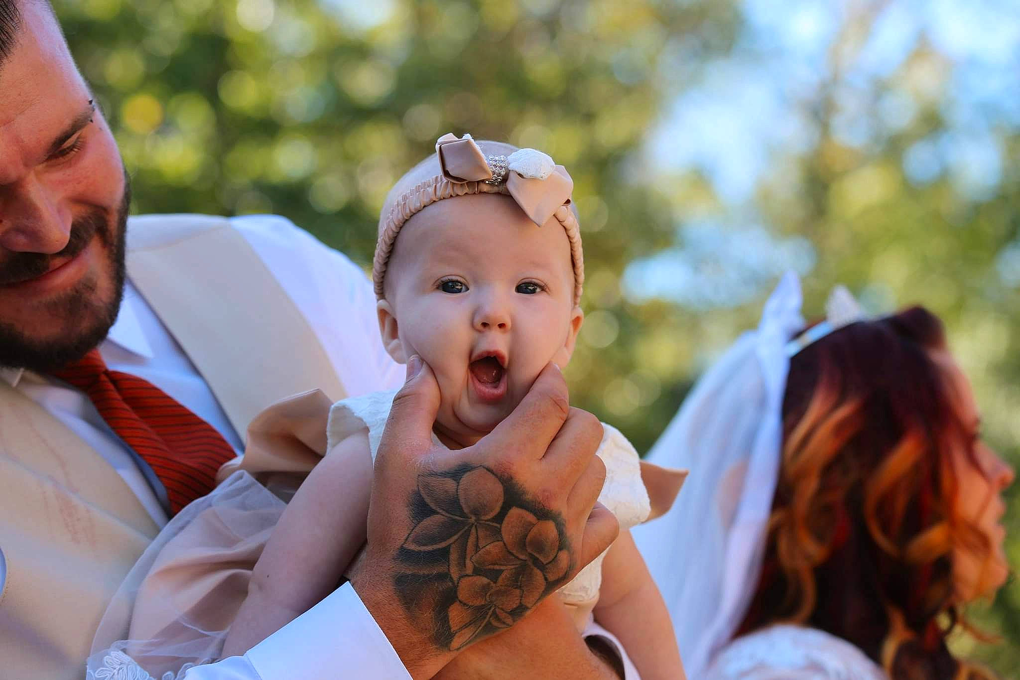 Anastasia is registered to the contest to win money with this photo: baby, bridal_clothing, child, event, eyewear, fashion_accessory, formal_wear, fun, gesture, grass, hair_accessory, happy, headpiece, jewellery, people_in_nature, person, skin, sunglasses, tie, toddler