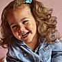 baby, blue_bow, child, childhood, clothing, curly_hair, cute, denim_shirt, face, hair, happy, indoor, joy, laughing, person, portrait, skin, smiling, toddler, young_child