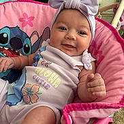 Willow joined the competition — help win amazing prizes! baby, child, smiling, pink, headband, bow, onesie, aloha, cutie, stitch, character, chair, indoor, cute, infant, happy, portrait, clothing, hand, face
