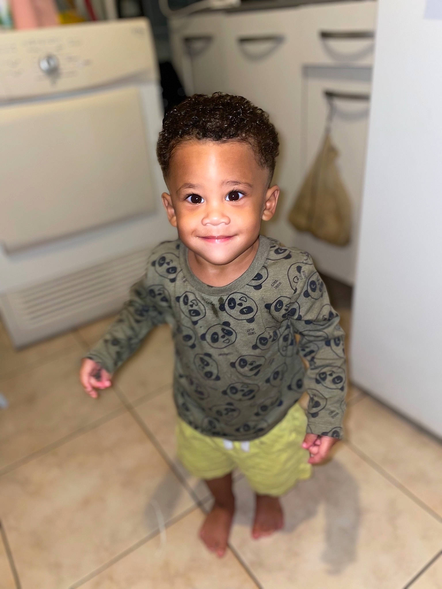 Kurtis participe au concours pour gagner de l'argent avec cette photo : baby_toddler_clothing, barefoot, cheek, child, chin, eye, floor, flooring, fun, happy, hardwood, joy, pattern, person, sitting, skin, sleeve, smile, toddler, trunk