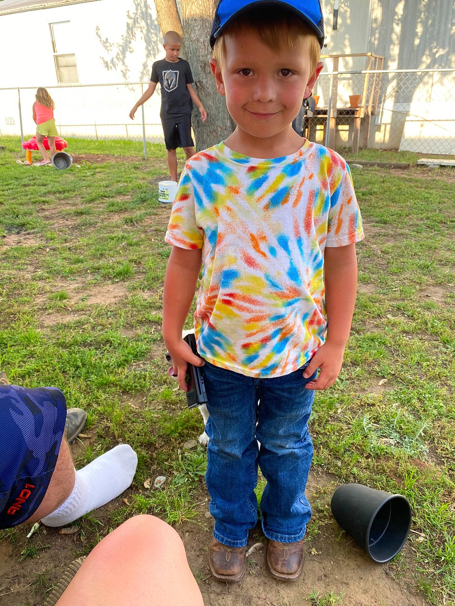 Eastyn is registered to the contest to win money with this photo: child, community, fashion_accessory, fun, grass, headgear, joy, person, plant, play, recreation, smile, soil, style, summer, t_shirt, toddler, tree, vacation