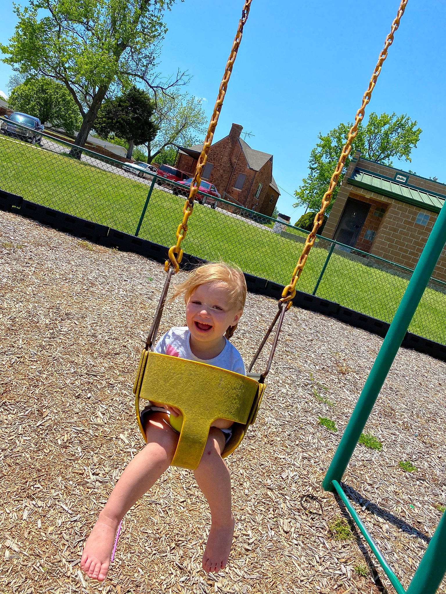 Teagyn joined the competition — help win amazing prizes! child, city, fun, grass, human_settlement, joy, leisure, outdoor_play_equipment, park, person, photography, plant, play, playground, public_space, recreation, smile, summer, swing, toddler