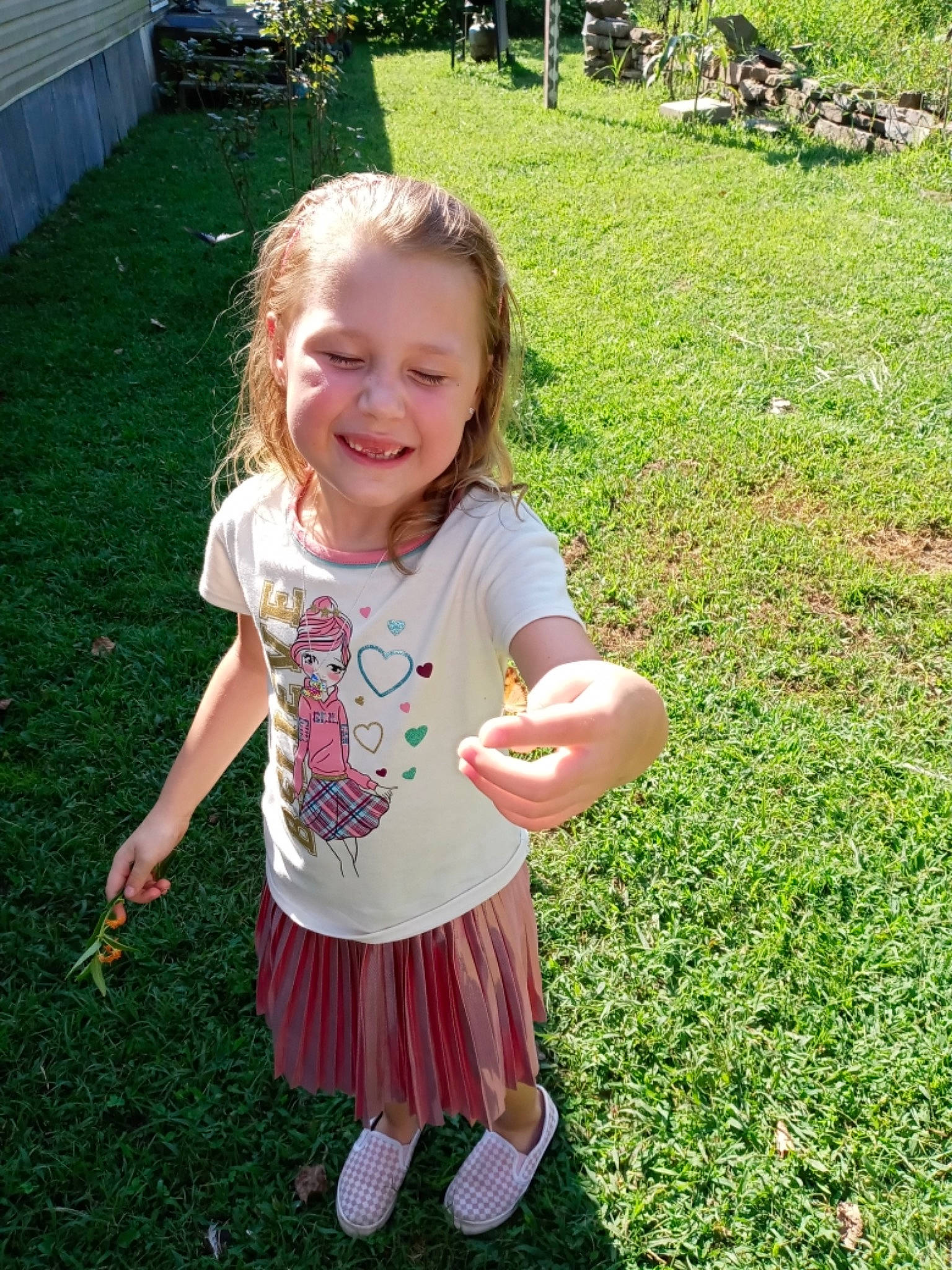 Sariya is registered to the contest to win money with this photo: baby_toddler_clothing, blond, fun, garden, grass, grass_family, groundcover, happy, joy, lawn, leaf, leisure, meadow, people_in_nature, person, pink, plant, recreation, sleeve, smile