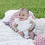 Lucymae joined the competition — help win amazing prizes! baby, infant, white_clothing, blanket, pillows, stuffed_toy, grass, outdoor, smiling, cute, child, soft_texture, playful, sitting, head, face, happy, young, natural_light, cozy